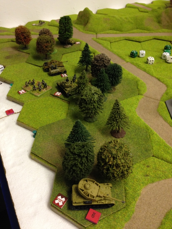 Panzers and Mech infantry take the woods to the left but not without loss